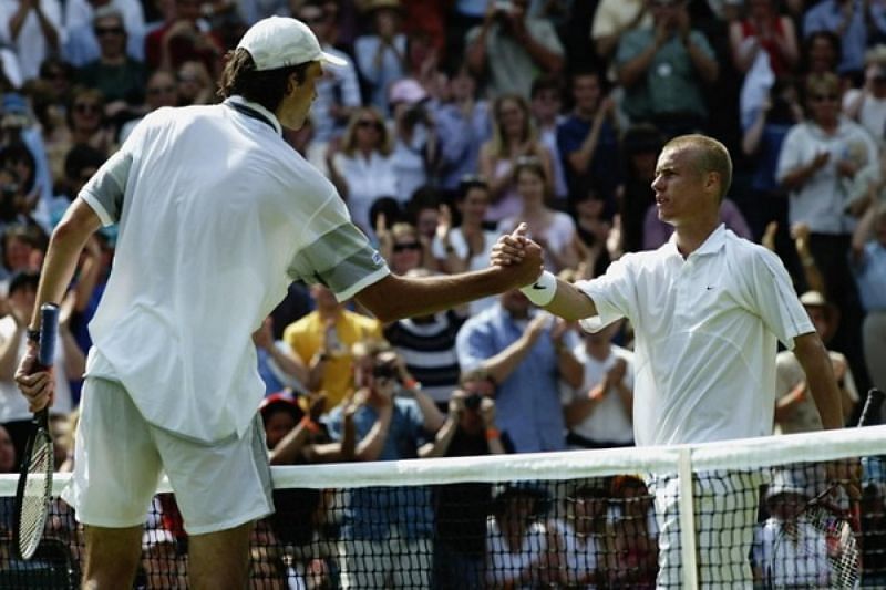 Ivo Karlovic (left) beat defending champion Lleyton Hewitt at 2003 Wimbledon.