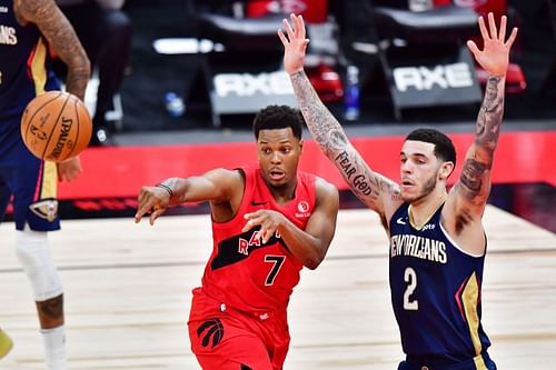 Kyle Lowry (#7) passes the ball against Lonzo Ball (#2).