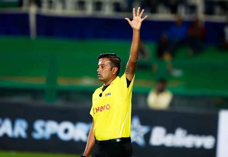 Umpire Raghuprasad officiating in a match (PC: Hockey India)