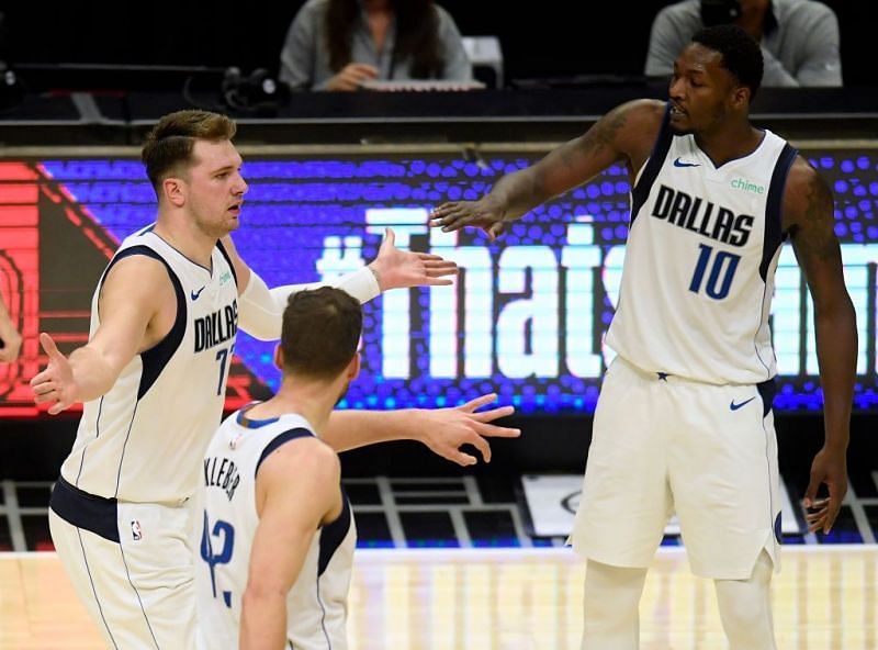 Dorian Finney-Smith (right) celebrates a play with Luka Doncic
