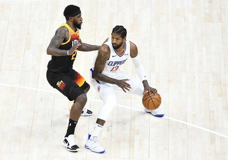 Paul George is guarded by Royce O&#039;Neale