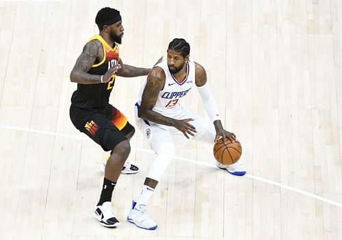 Paul George is guarded by Royce O'Neale