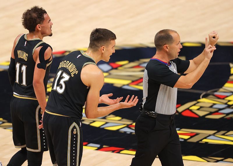 Bogdan Bogdanovic (#13) of the Atlanta Hawks pleads to the referee.