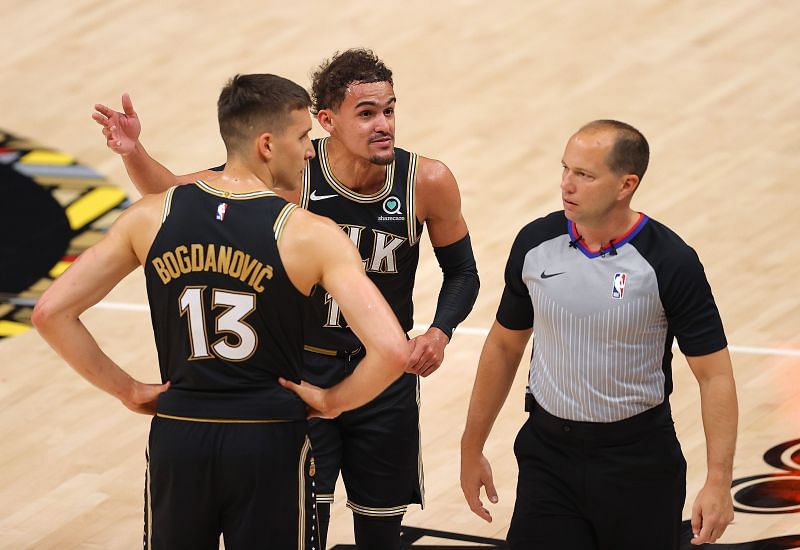 Young #11 and Bogdan Bogdanovic #13 react to a referee&#039;s call.