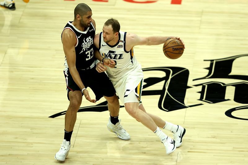 Nicolas Batum #33 of the LA Clippers defends against the dribble of Joe Ingles #2 of the Utah Jazz during the first half of a game at Staples Center on June 12, 2021 in Los Angeles, California.
