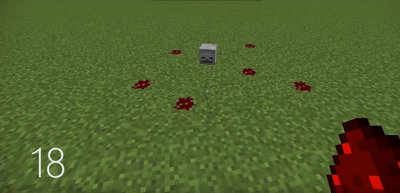 A scary build hack that uses a Skeleton head and Redstone (Image via Grian on YouTube)