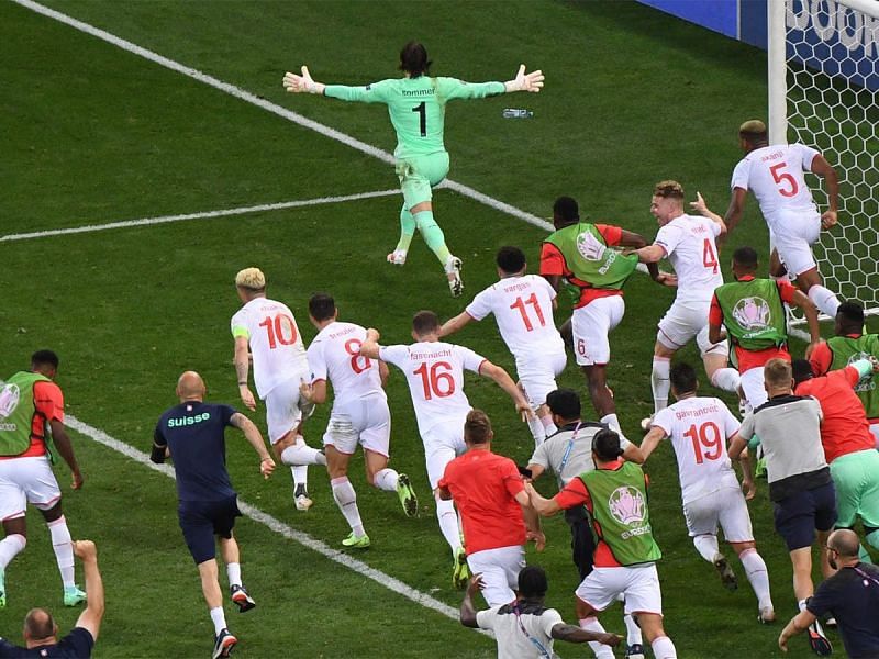 Jan Sommer is joined by his euphoric teammates after Switzerland beat France at Euro 2020.