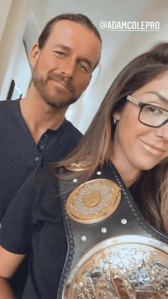 Adam Cole with Britt Baker and the AEW Women&#039;s World Championship
