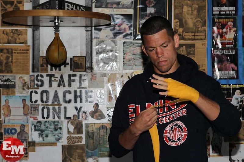 Nate Diaz wrapping up to work the punching bag.