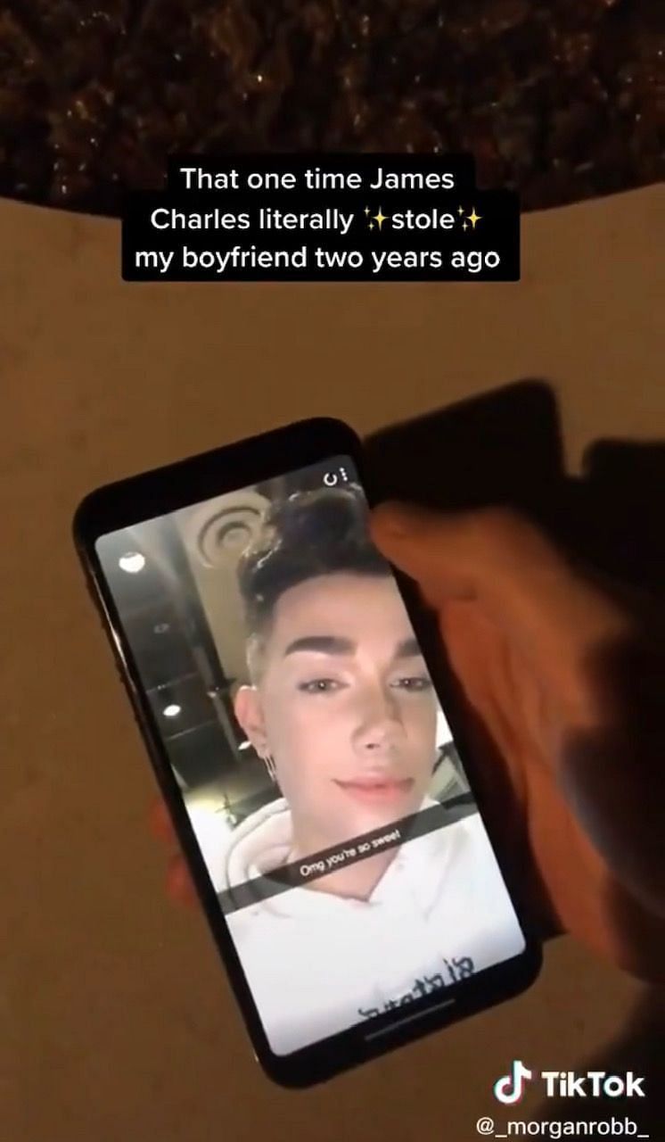 She then plays a video of her ex-boyfriend opening a snapchat from James Charles (Image via Twitter)