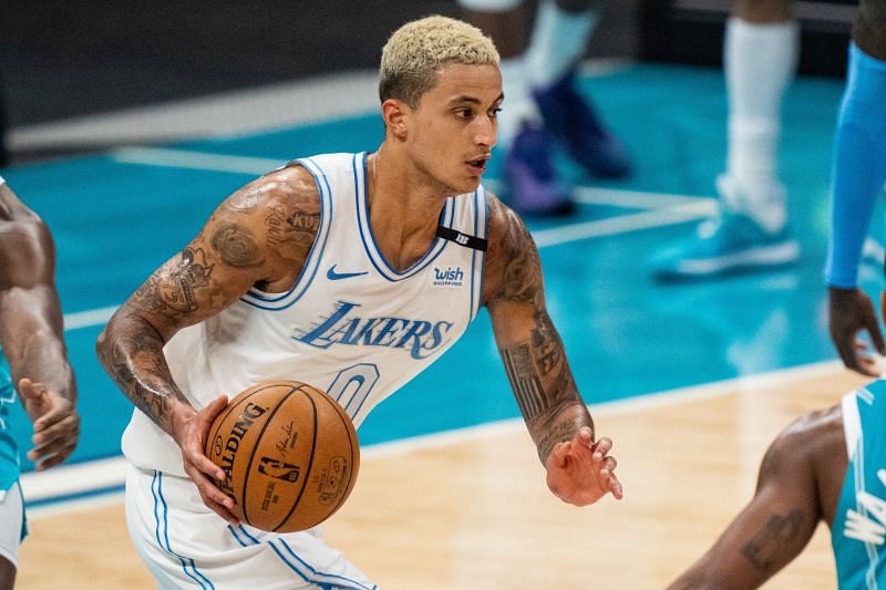 Kyle Kuzma #0 brings the ball up court against the Charlotte Hornets.