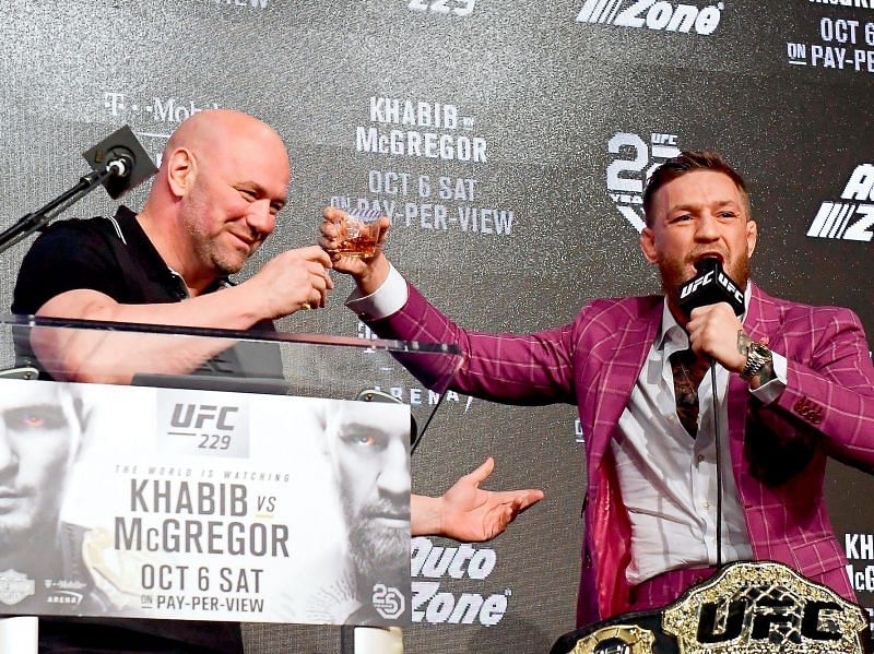 Dana White and Conor McGregor share a drink at UFC 229 press-conference