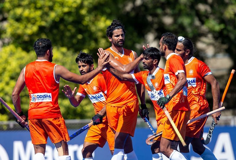 Indian hockey players celebrate a goal against Argentina - Hockey India