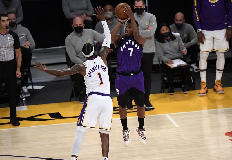 Kyle Lowry (#7) shoots and scores a three-point basket and is fouled by Kentavious Caldwell-Pope (#1).