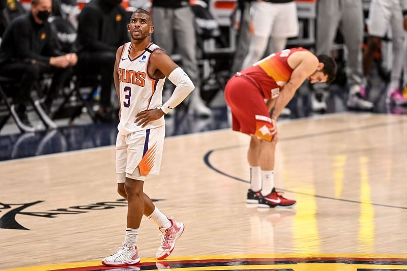 The Phoenix Suns&#039; Chris Paul #3 walks on the court close to Facundo Campazzo #7