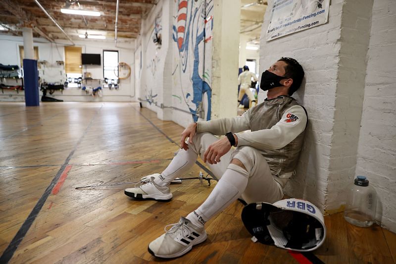 Great Britain fencer Marcus Mepstead takes a break during a sparring session