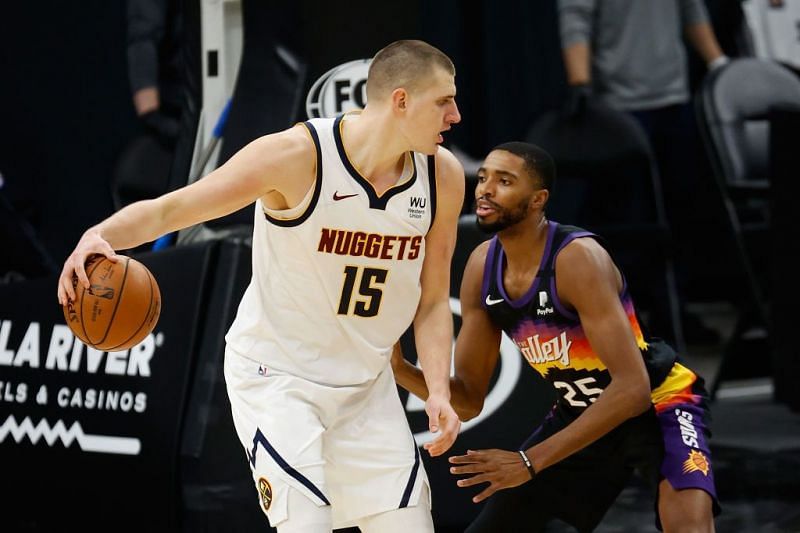 Nikola Jokic posts up against Mikal Bridges