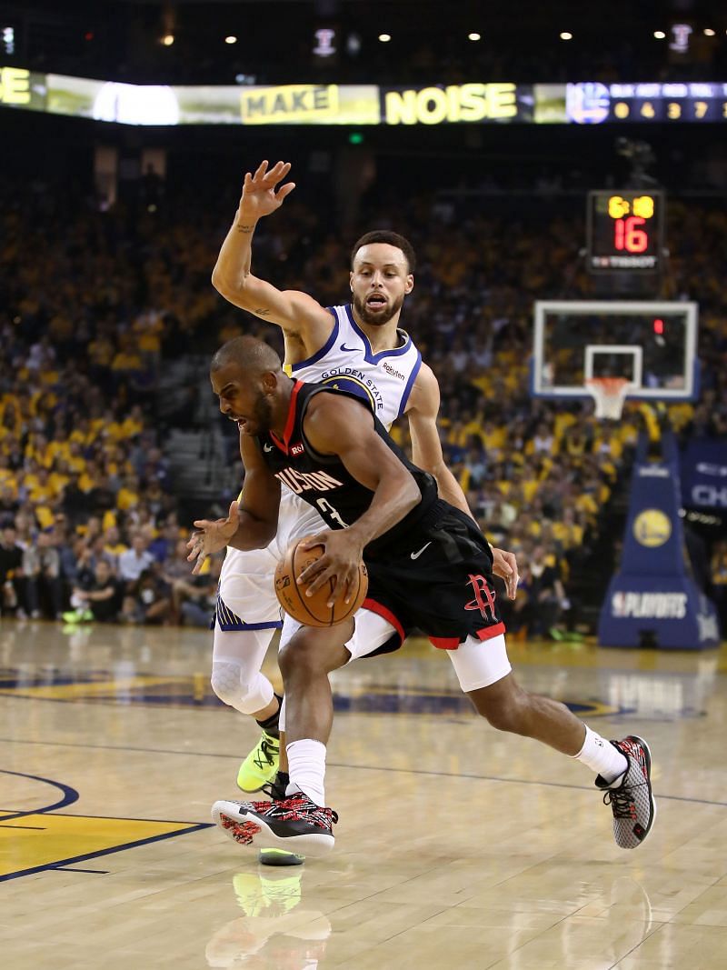 Chris Paul (#3) of the Houston Rockets drives on Stephen Curry (#30) of the Golden State Warriors during Game Five of the Western Conference Semifinals
