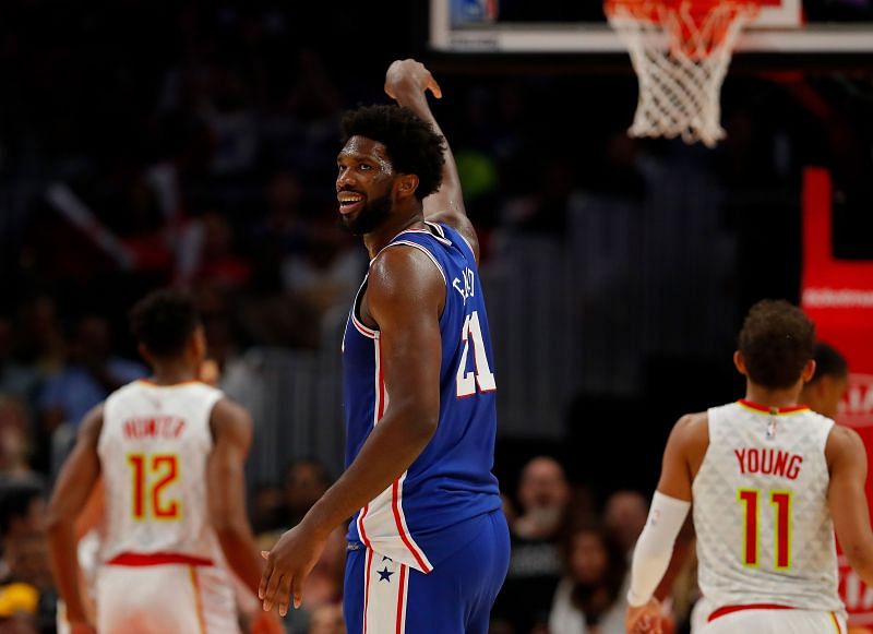 Joel Embiid #21 reacts after hitting a three-point basket