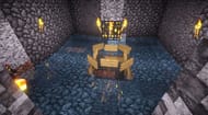 A player using a naturally found mob spawner to create a mob farm (Image via craftymynes)