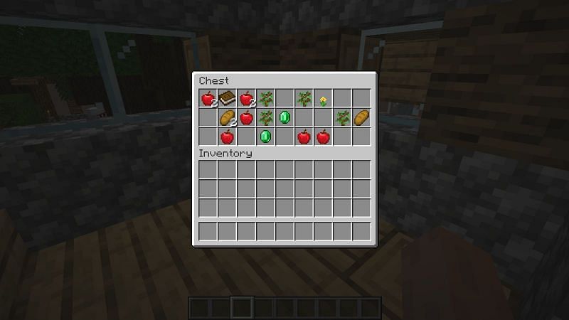 Emeralds inside the chest of a village house (Image via Minecraft)