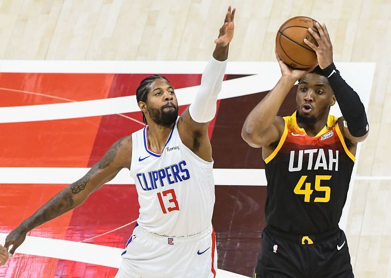 Donovan Mitchell shoots over Paul George