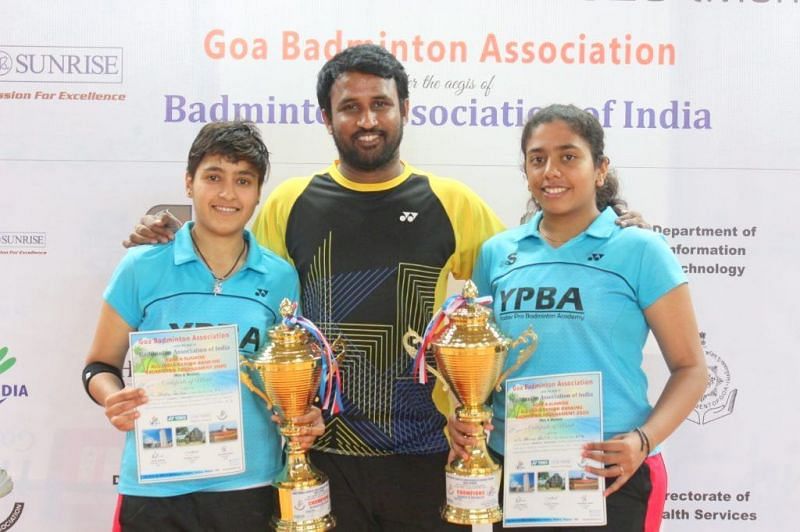 Shikha Gautam and K. Ashwini Bhat (right) with coach Jagdish Yadav (center)