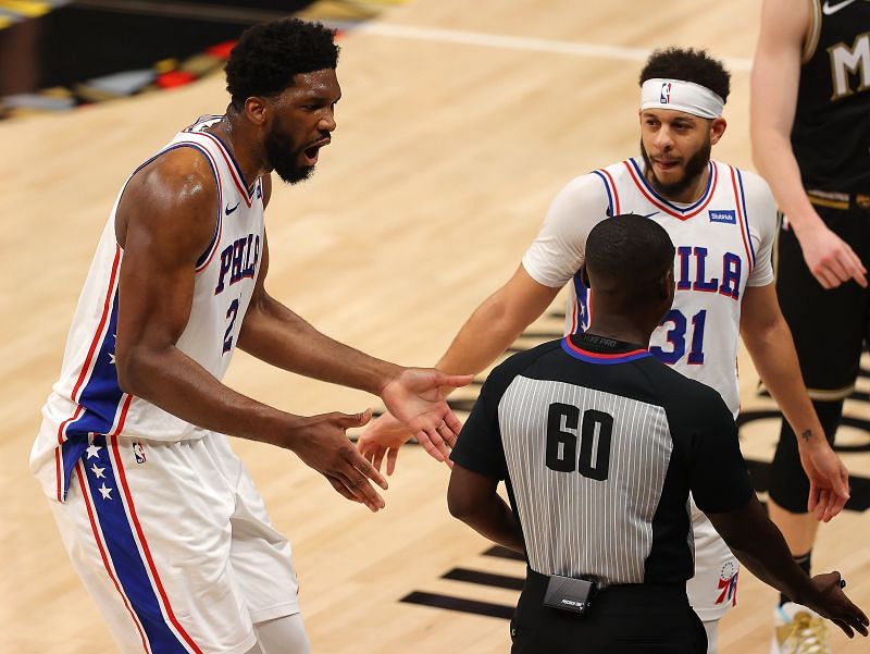 Joel Embiid (#21) of the Philadelphia 76ers reacts after an offensive foul against Clint Capela (#15) of the Atlanta Hawks