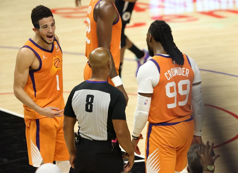 Devin Booker #1 argues a fifth foul call on teammate Jae Crowder #99.