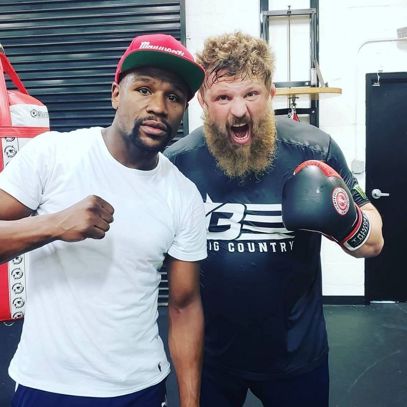 Roy Nelson (right) with Floyd Mayweather