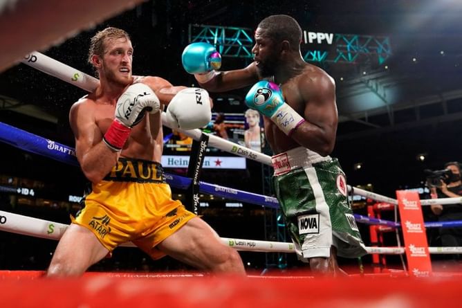 WWE Superstars and the pro-wrestling world react to Logan Paul vs. Floyd Mayweather