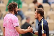 Reilly Opelka (L) and Daniil Medvedev shake hands