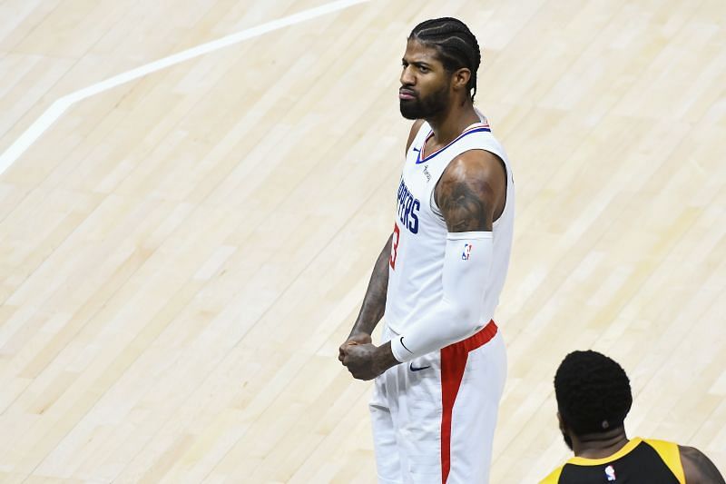 Paul George exults after scoring a basket