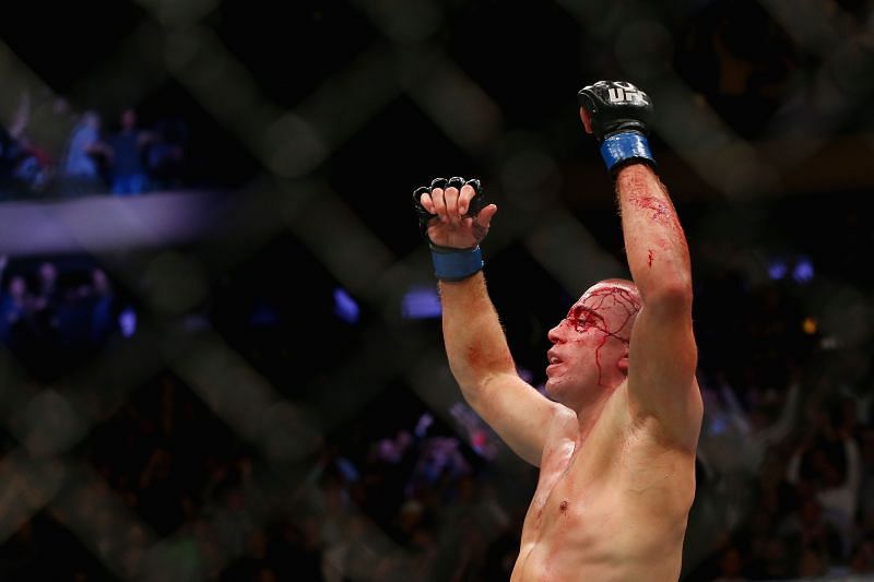 Georges St-Pierre celebrates his championship win at UFC 217.