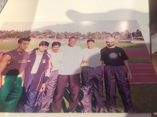 The Indian 4x100 relay team with USA athletics coach John Smith. with the Indian athletes