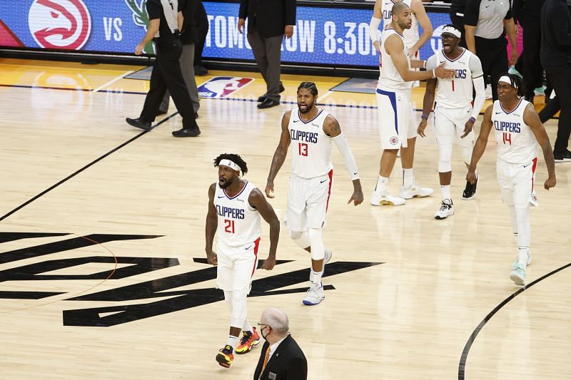 Patrick Beverley #21, Paul George #13, and Terance Mann #14 react during the fourth quarter of Game 2.