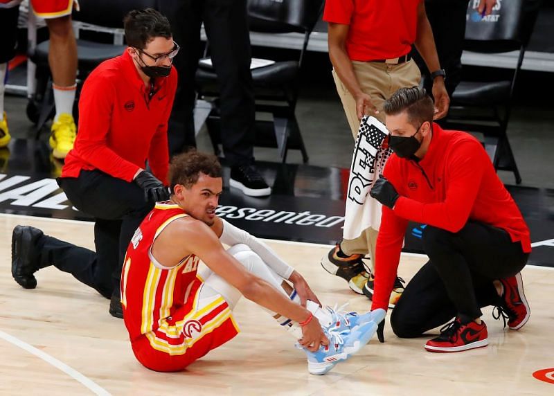 Trae Young gets medical attention after hurting himself