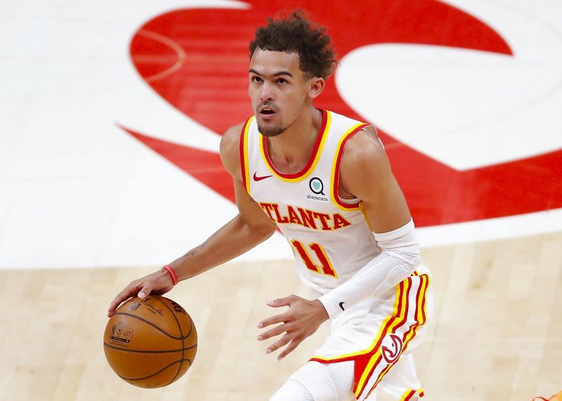 Trae Young #11 prepares to drive to the basket