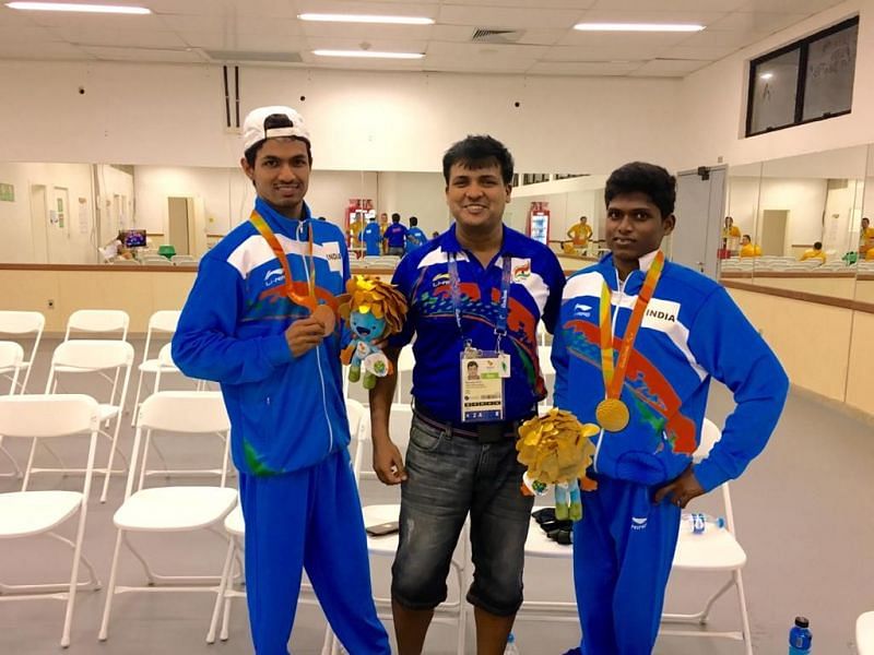 Dr. Nayak with high-jump medalists Mariyappan Thangavelu and Varun Bhati at Rio Paralympics 2016