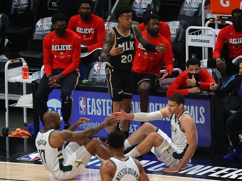 John Collins #20 reacts to fouling Brook Lopez #11