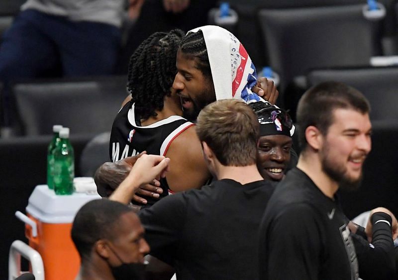 Paul George celebrates with Terance Mann