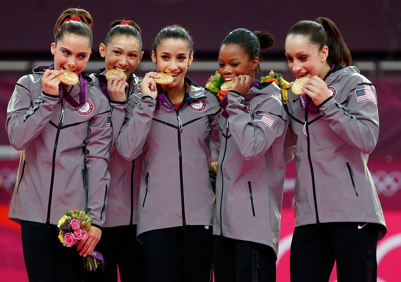 Aly Raisman (3rd from left) poses for the photographs after winning the gold medal in the women&#039;s team event at the 2012 London Olympics (Photo by Jamie Squire/Getty Images)