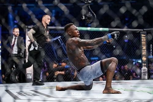 Israel Adesanya celebrates after a win