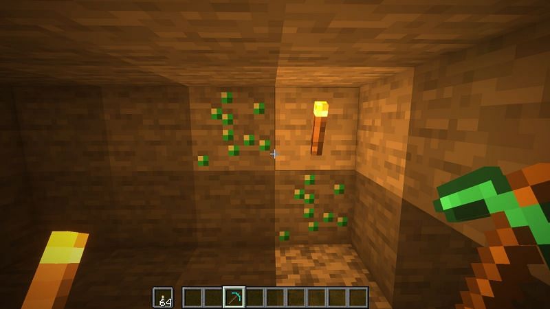 Two emerald ores (Image via Minecraft)