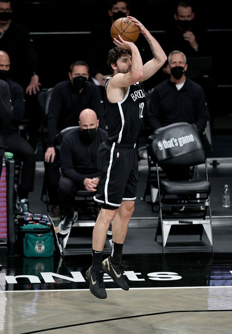Joe Harris (#12) of the Brooklyn Nets takes a three-point shot.