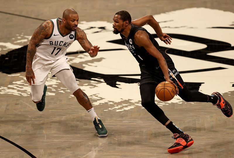 Kevin Durant #7 of the Brooklyn Nets drives past P.J. Tucker #17 of the Milwaukee Bucks