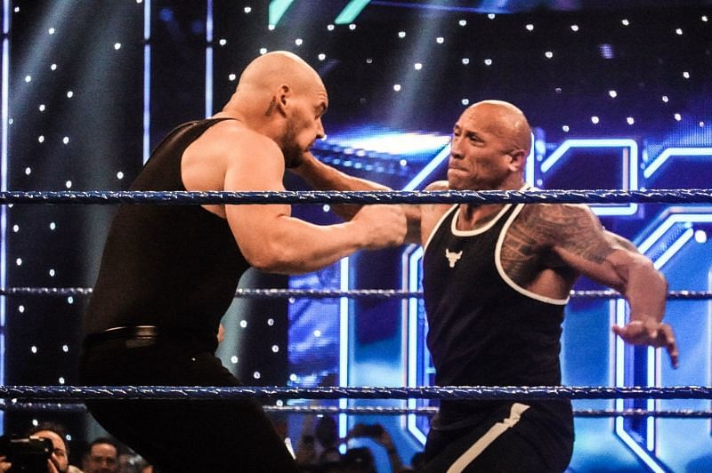 The Rock lands a punch on Baron Corbin