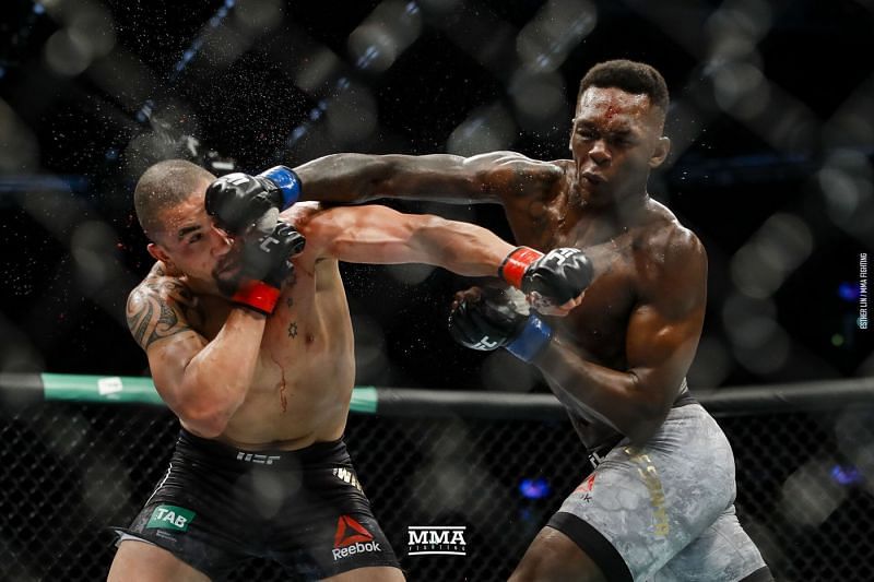 Israel Adesanya lands a counter-right on Robert Whittaker