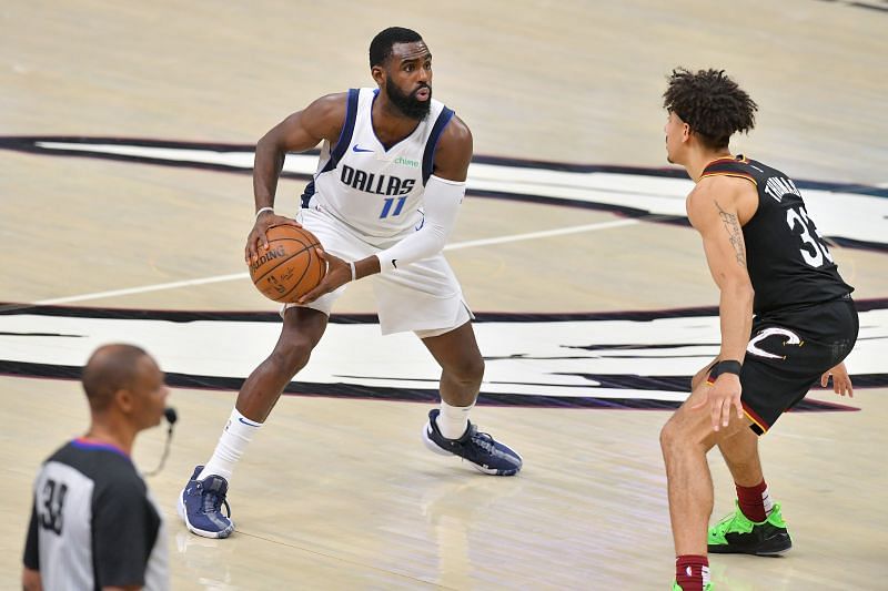 Tim Hardaway Jr. #11 looks for a pass while under pressure from Brodric Thomas #33.