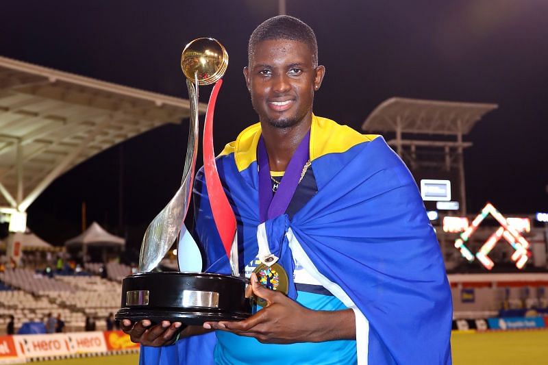 Jason Holder, captain of the Barbados Tridents, poses with the CPL trophy